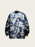 Camouflage-patterned jacket on a light beige background