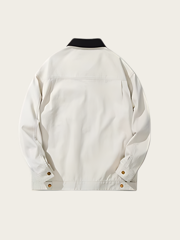 White jacket with black collar on a light beige background