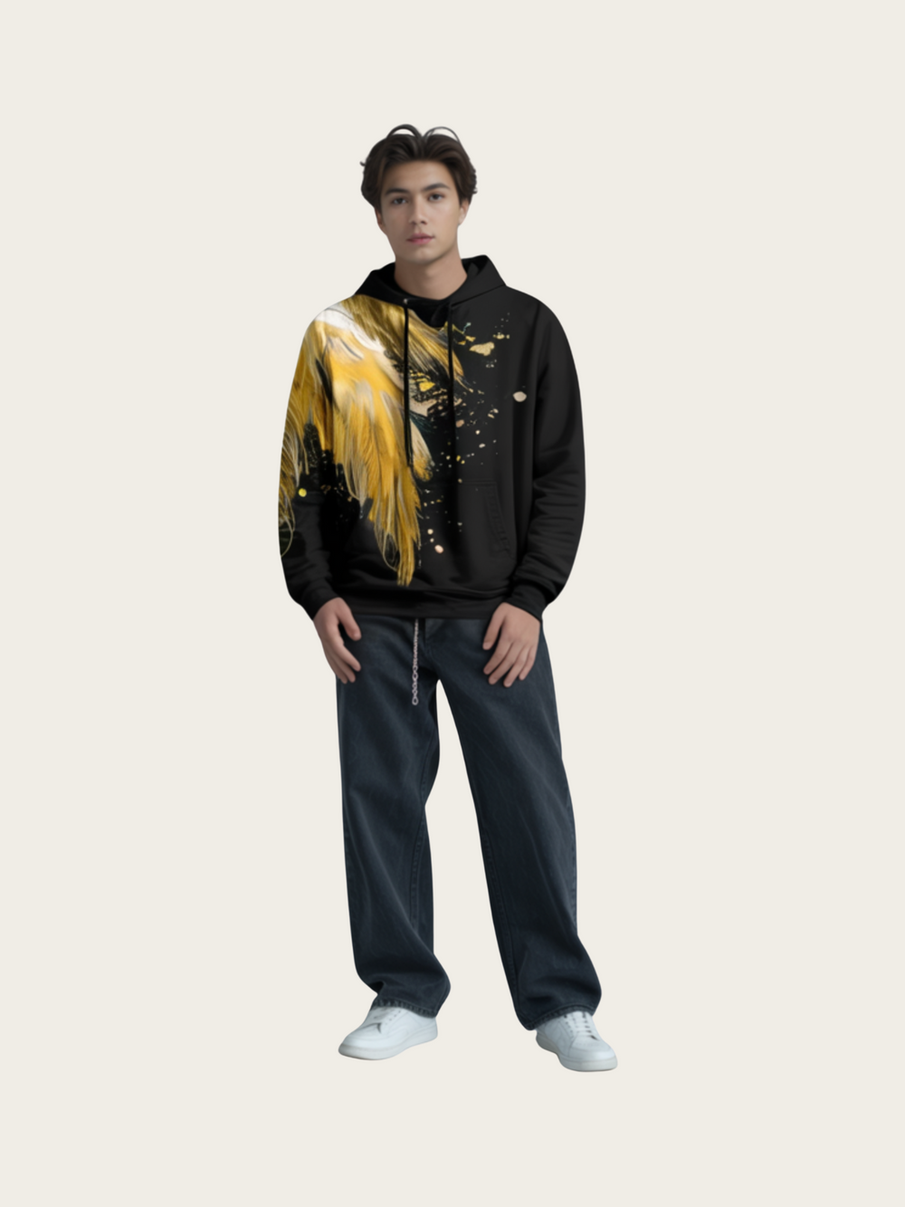 Person wearing a black hoodie with yellow abstract design and dark jeans on a light gray background