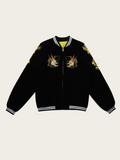 Black jacket with embroidered designs on a beige background