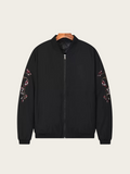 Black jacket with floral embroidery on sleeves against a white background
