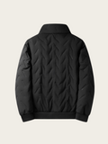 Black quilted jacket on a light gray background