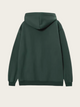 Green hoodie on a light beige background