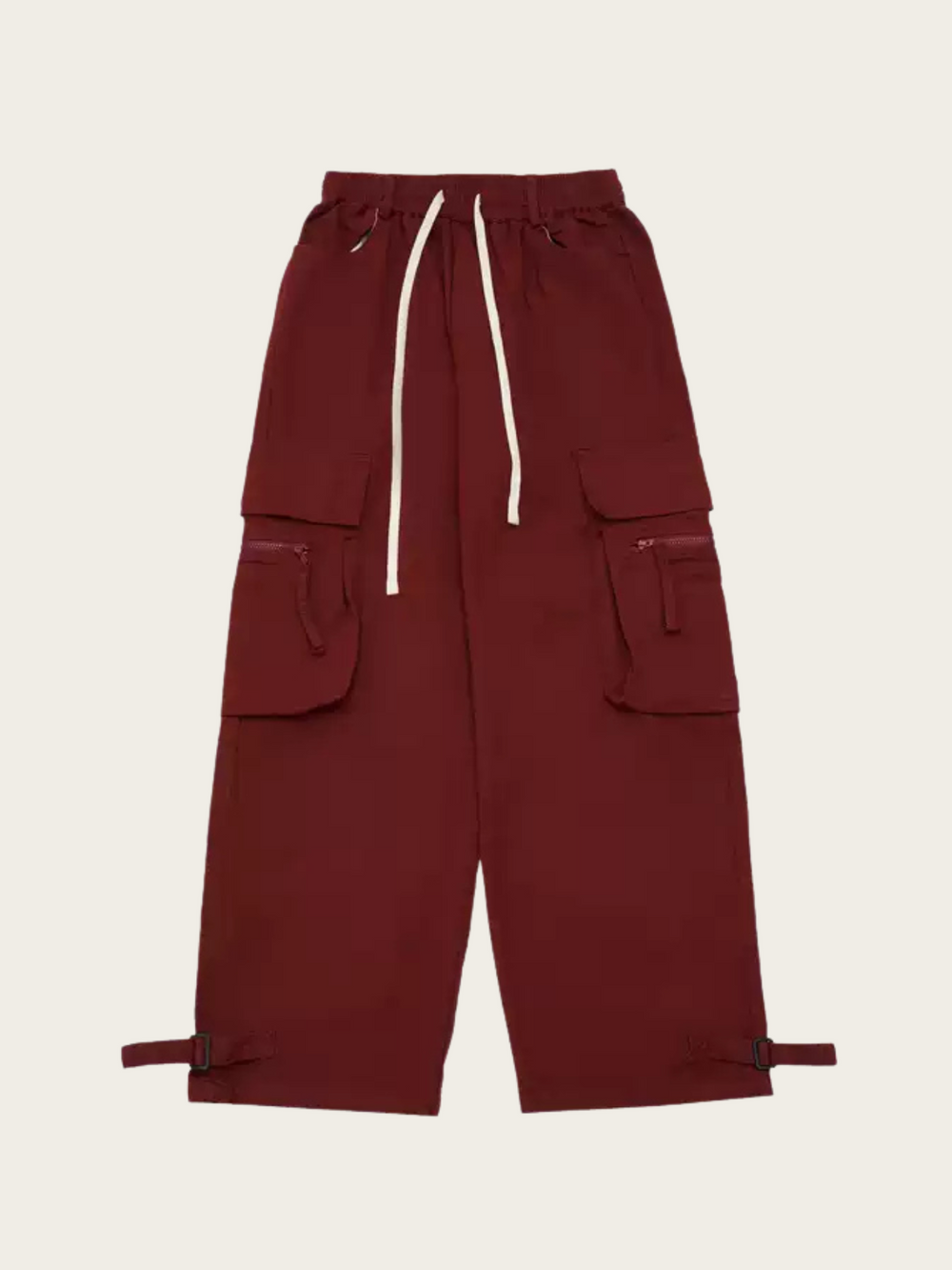 Maroon cargo pants with multiple pockets on a beige background