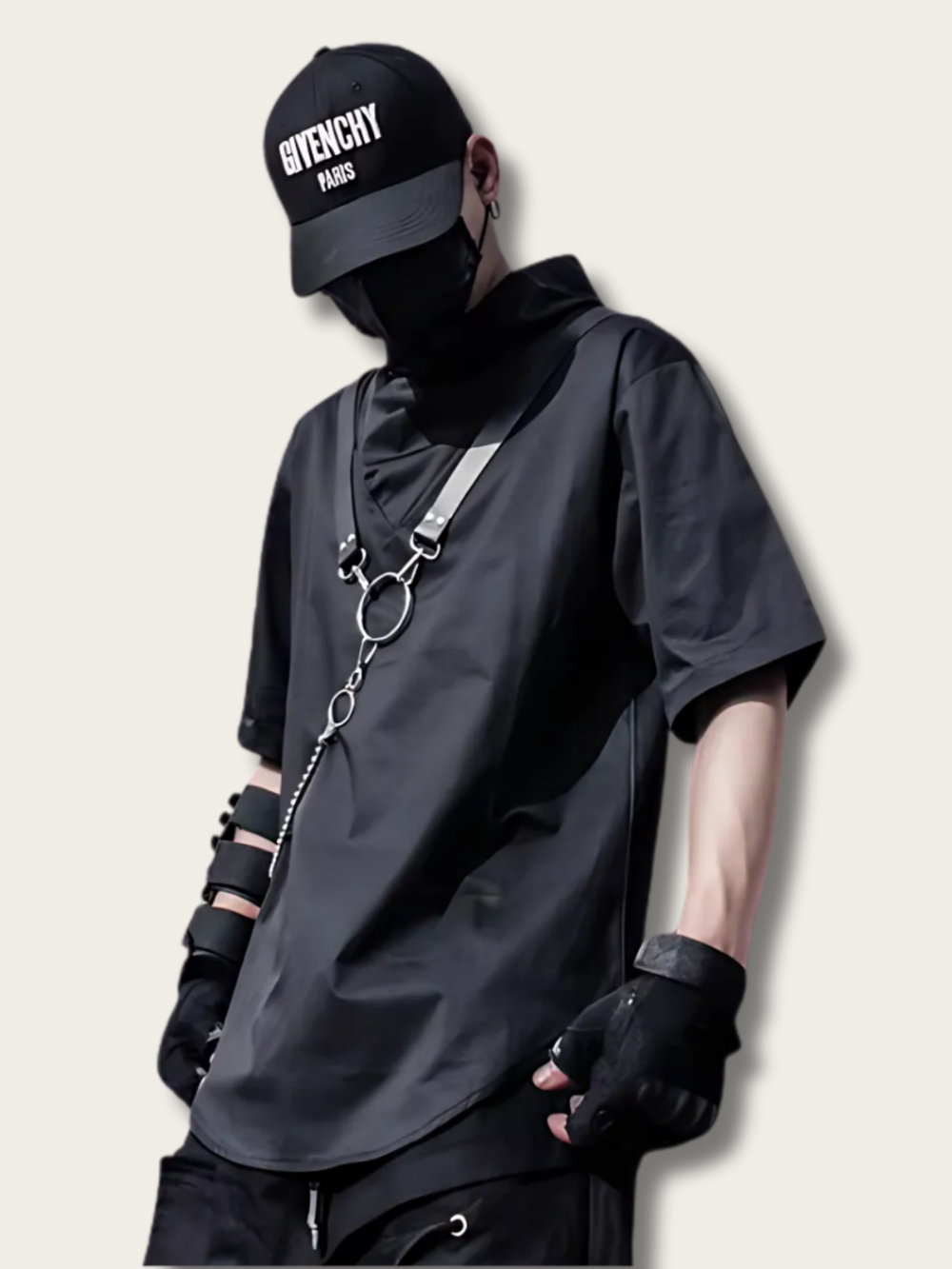 Person wearing a black outfit with a Givenchy cap on a light gray background