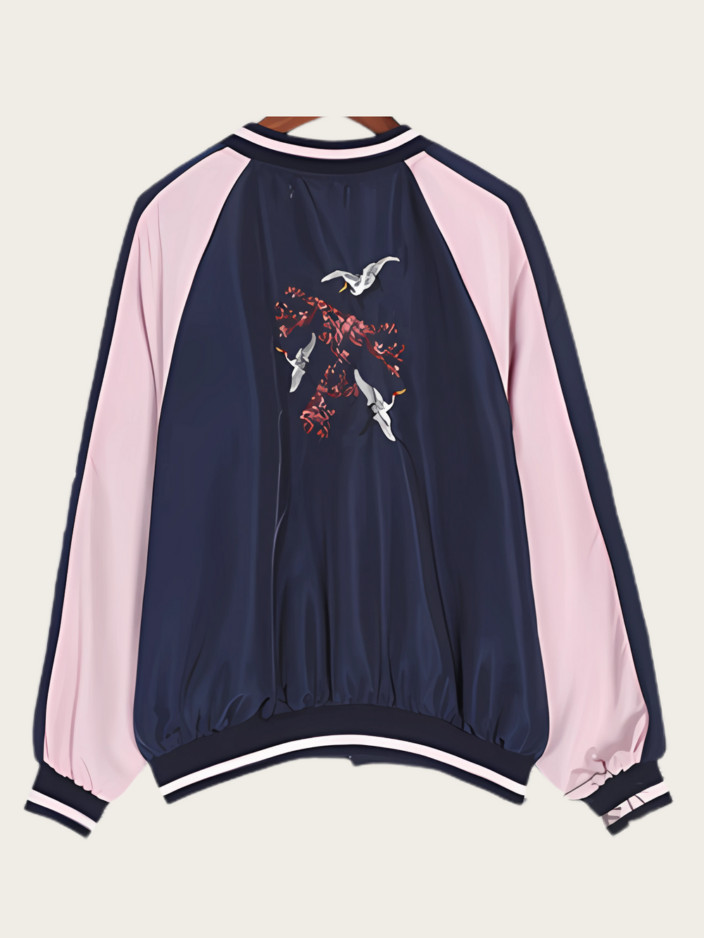 Navy and pink jacket with a graphic design on the back against a white background