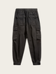 Black cargo jogger pants on a light gray background
