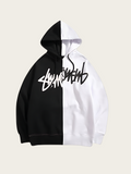 Black and white hoodie with brand logo on a beige background