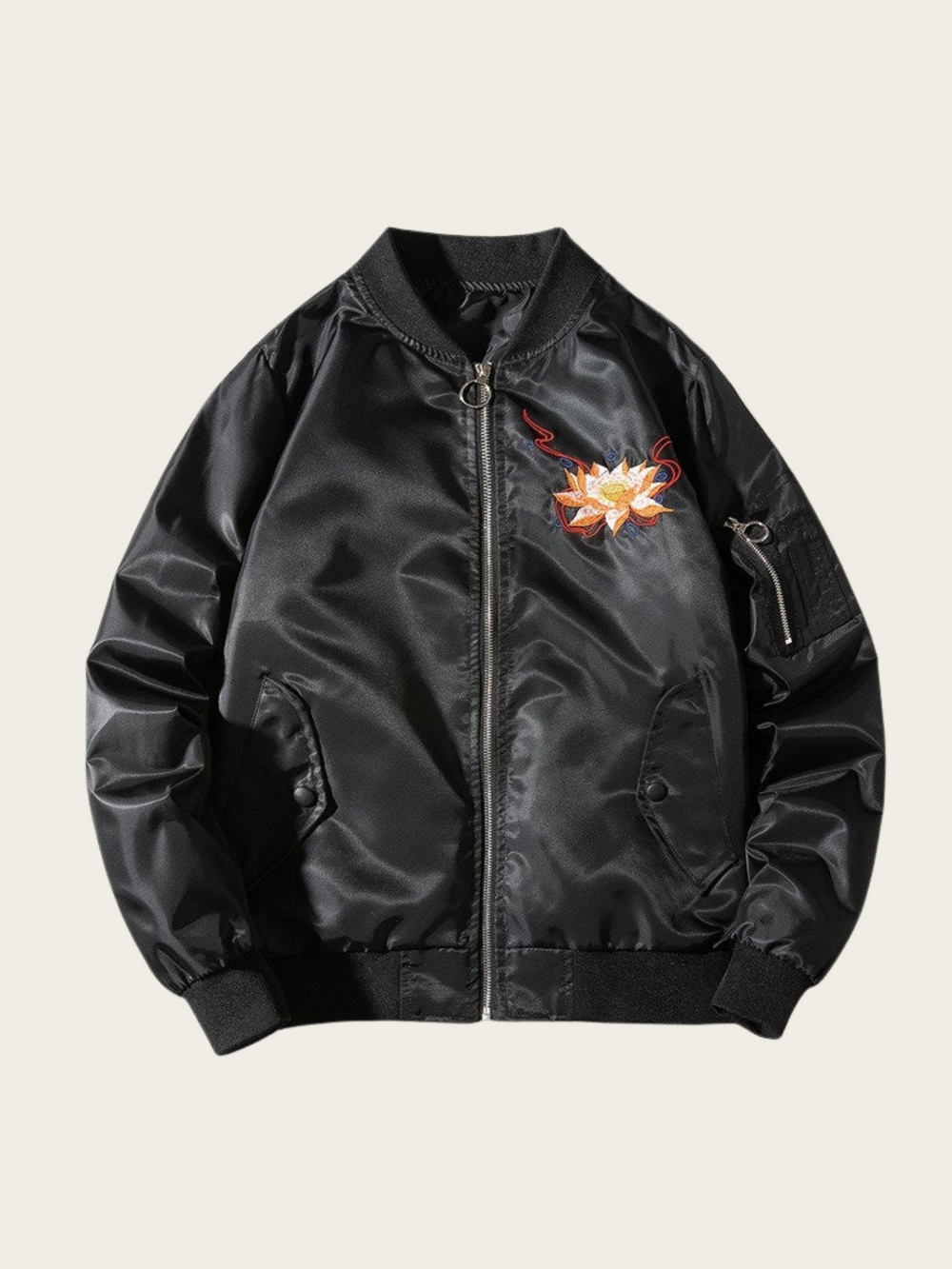 Black bomber jacket with floral embroidery on a beige background