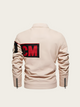 Beige jacket with a red and black logo on the back against a white background