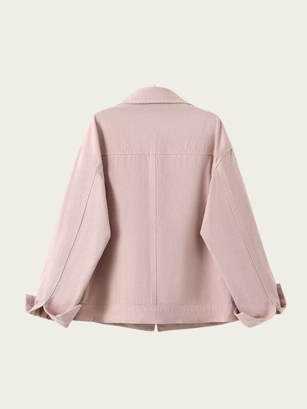 Pink denim jacket on a light pink background