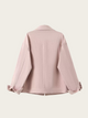 Pink denim jacket on a light pink background
