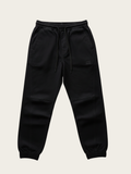 Black jogger pants on a beige background