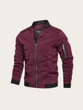 Maroon jacket with black accents on a beige background