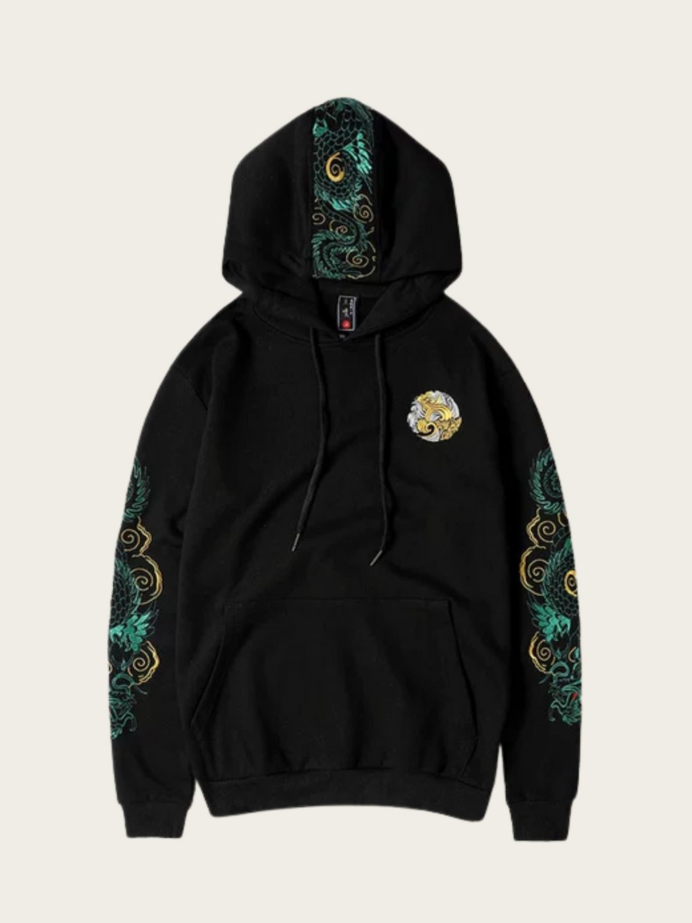Black hoodie with green and gold designs on sleeves and chest on a beige background