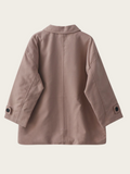 Brown coat on a light beige background