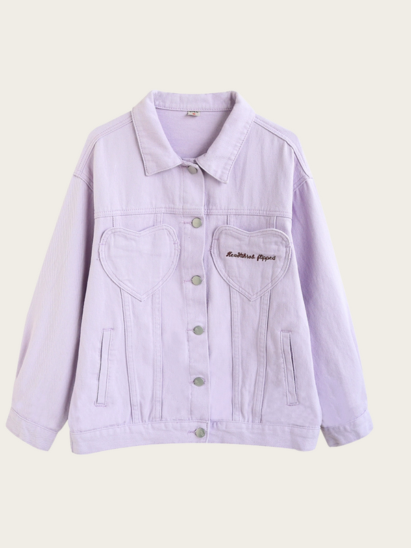 Light purple denim jacket with heart-shaped pocket on a beige background