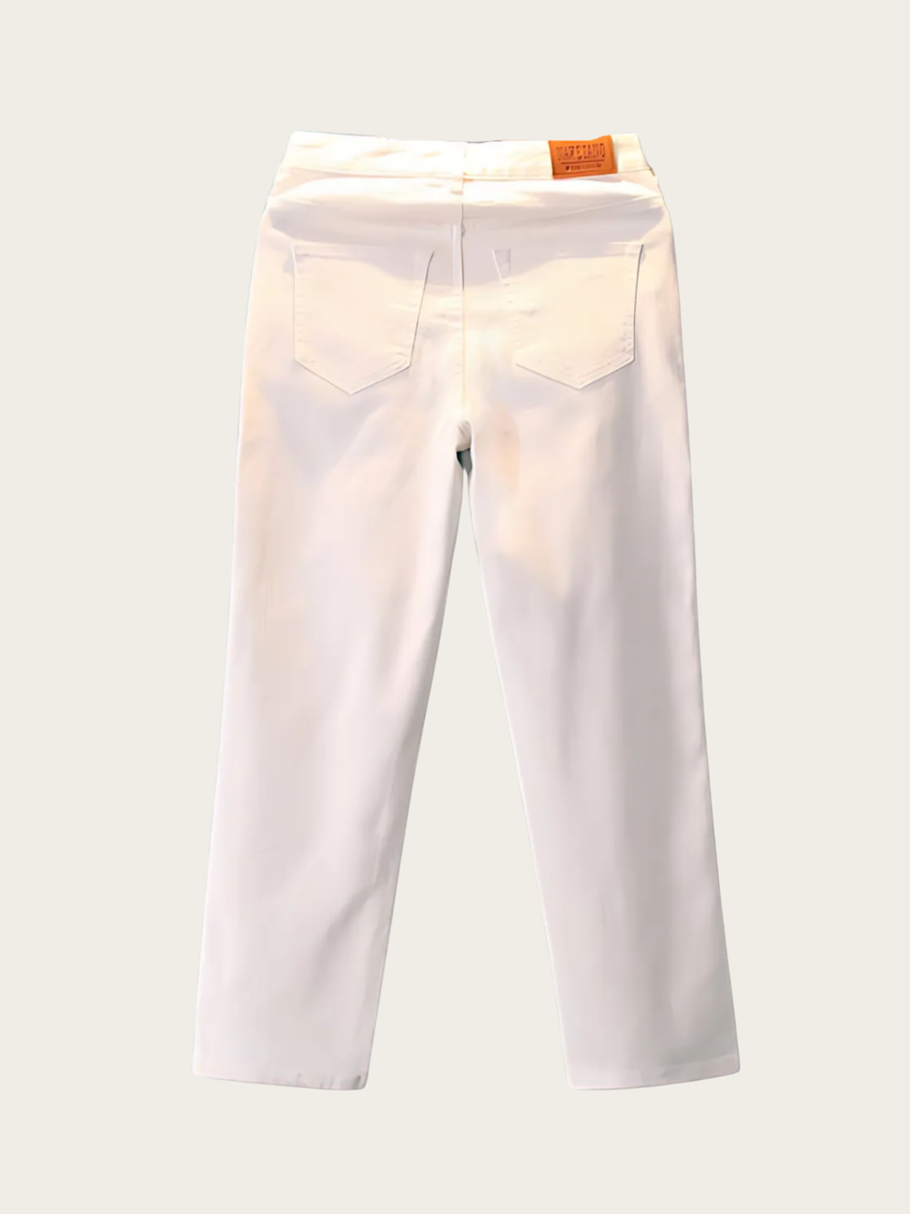 White pants with a brand label on a light gray background