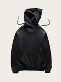 Black hoodie on a light beige background