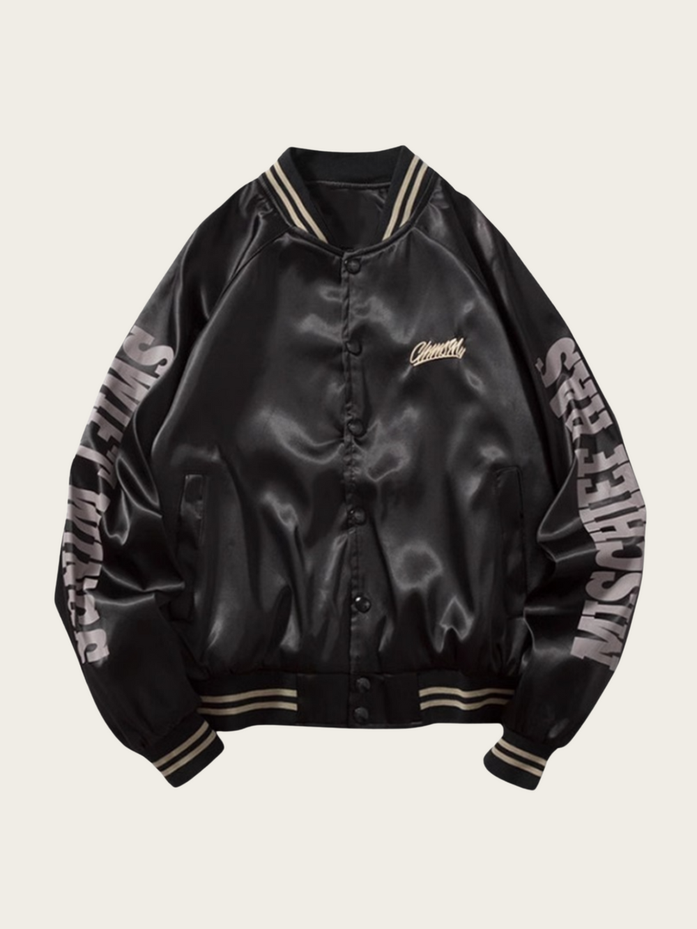 Black satin bomber jacket with text on sleeves against a beige background