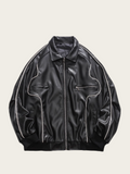 Black leather jacket with white stitching on a beige background