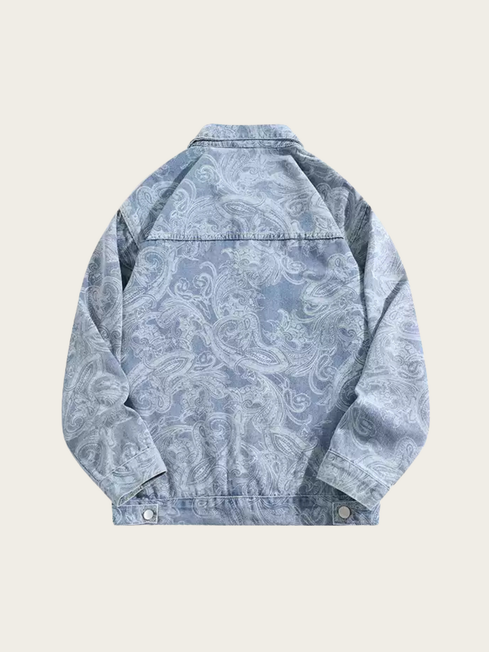 Blue denim jacket with white paisley pattern on a light beige background