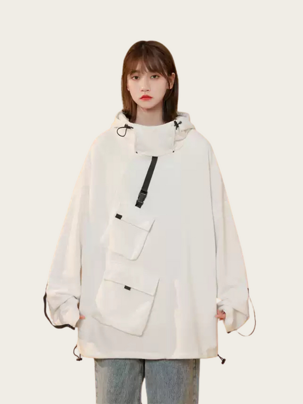 Person wearing a white oversized jacket with a front pocket on a white background