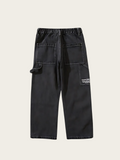 Black pants with multiple pockets on a light gray background