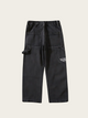 Black pants with multiple pockets on a light gray background