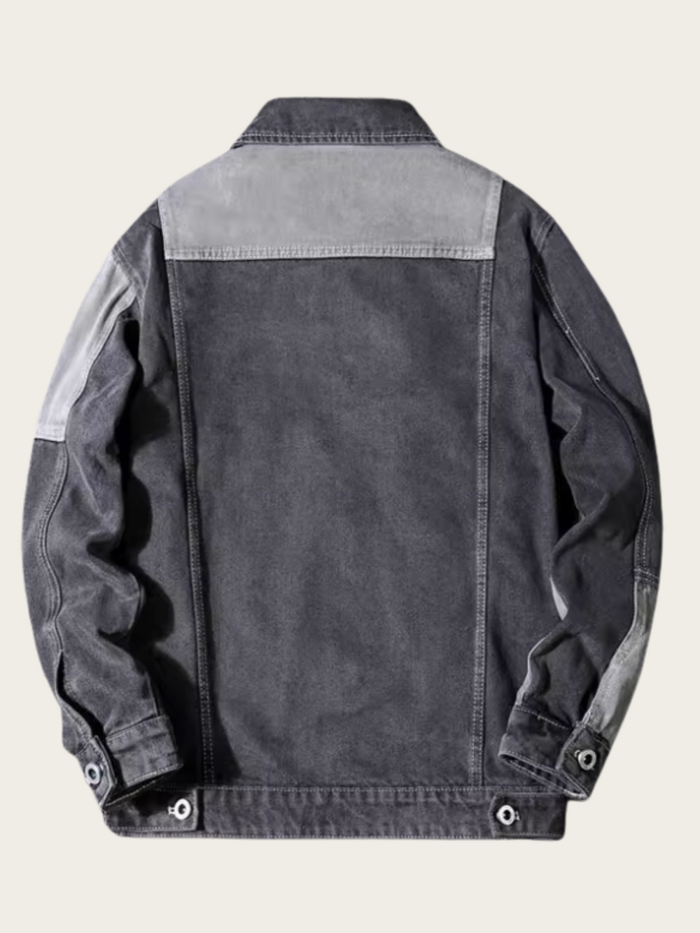 Dark denim jacket with light gray collar on a beige background