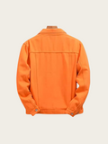Orange jacket on a mannequin against a light beige background
