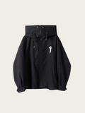 Black skirt with a logo on a beige background