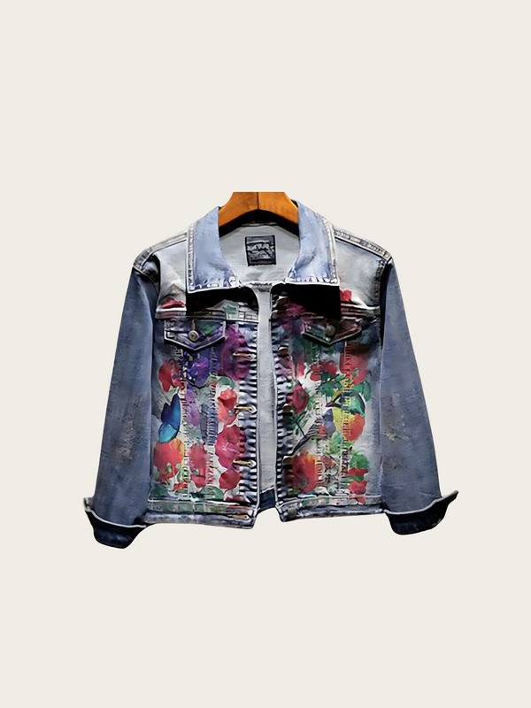 Denim jacket with floral patterns on a light gray background