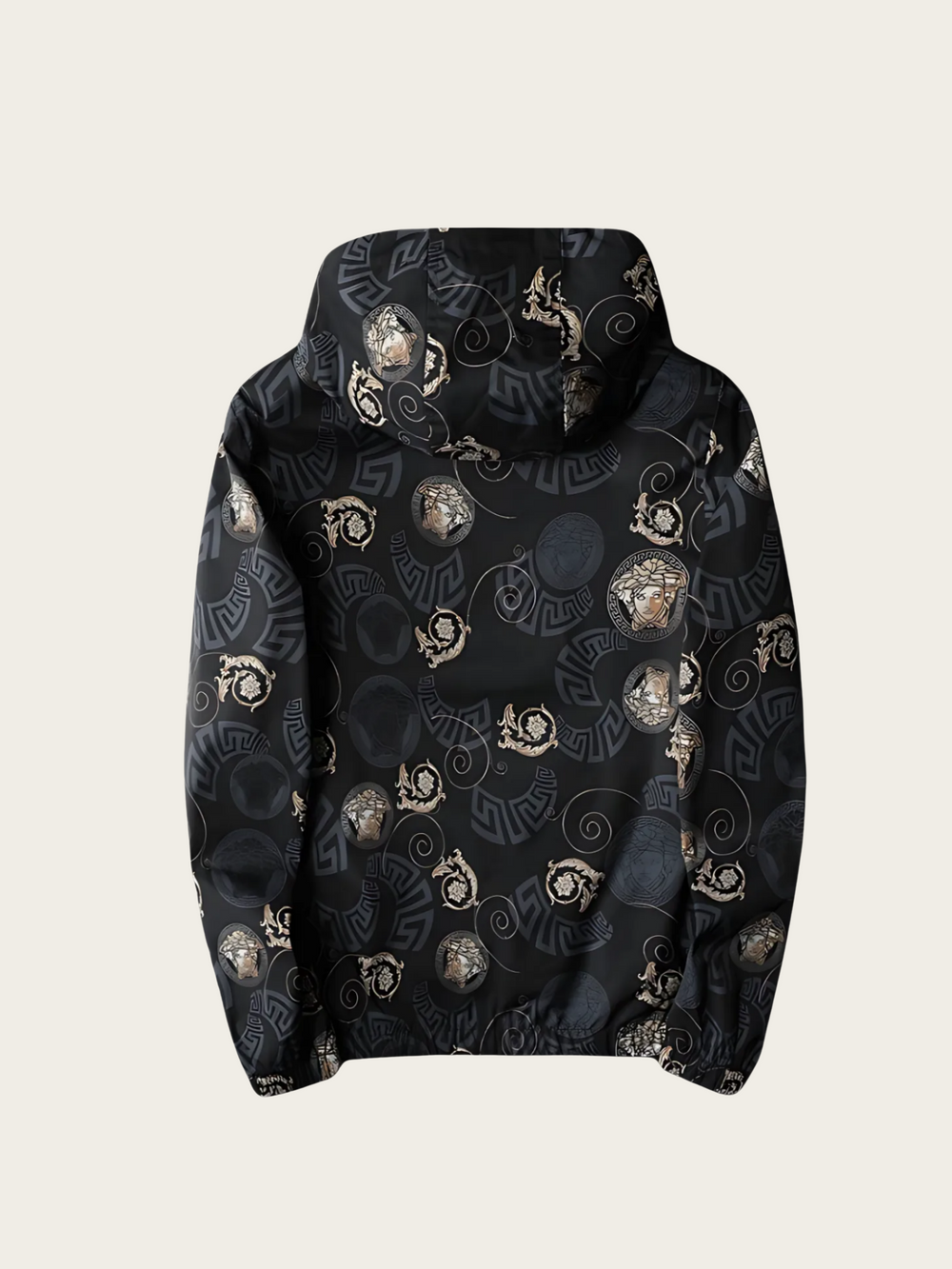 Black hoodie with gold and white pattern on a beige background