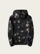 Black hoodie with gold and white pattern on a beige background