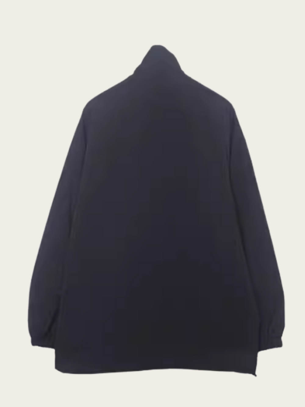 Navy blue sweater on a light beige background