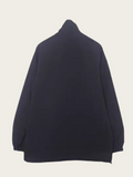 Navy blue sweater on a light beige background