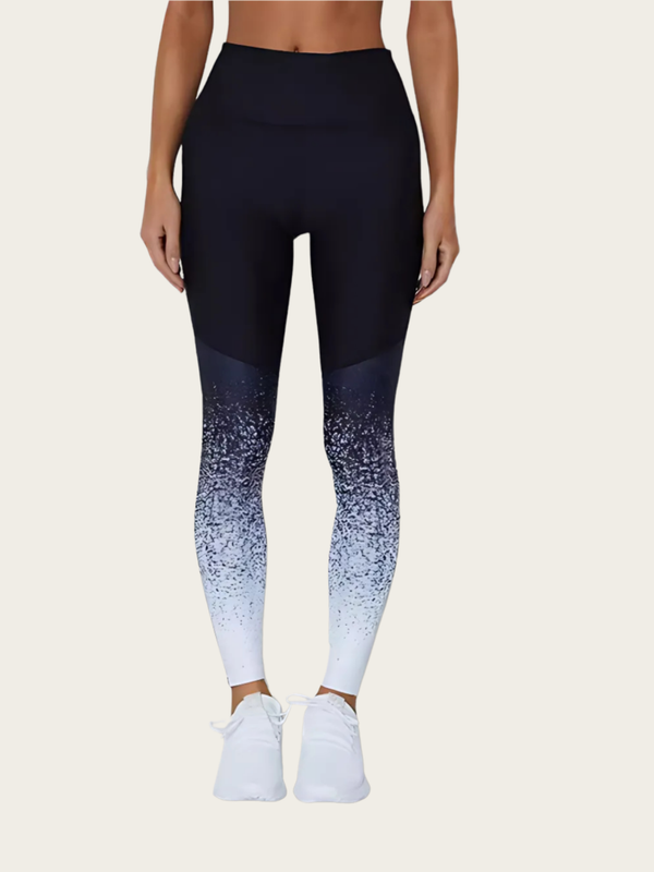 Person wearing black and blue gradient leggings on a white background