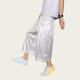 Person wearing white pants and shoes