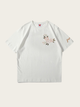 White t-shirt with floral embroidery on a light gray background