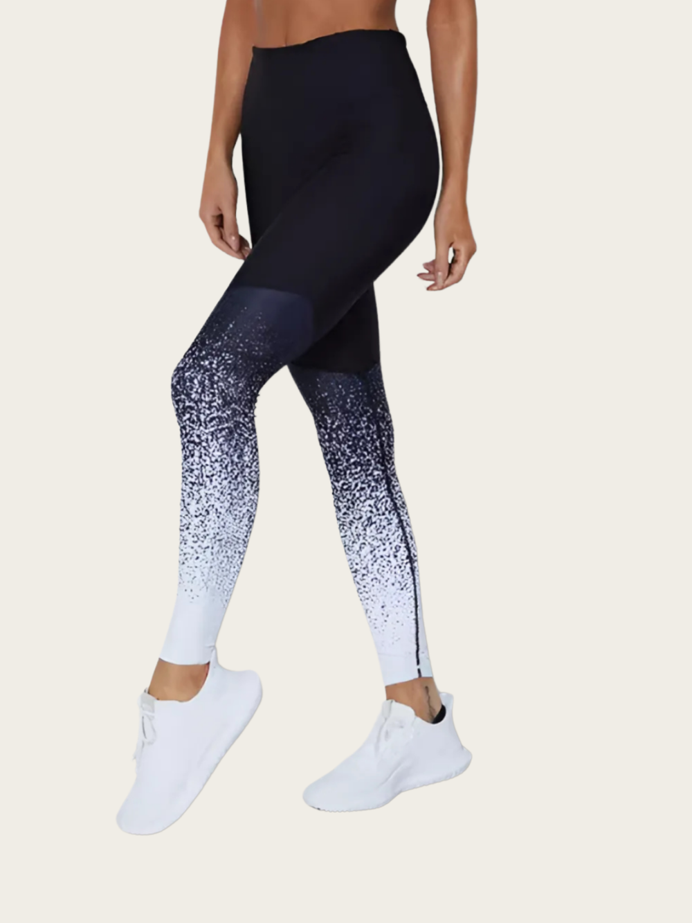 Black and white gradient leggings worn by a person on a beige background