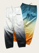 Two gradient pants with 'QUENTIN' branding on a light gray background