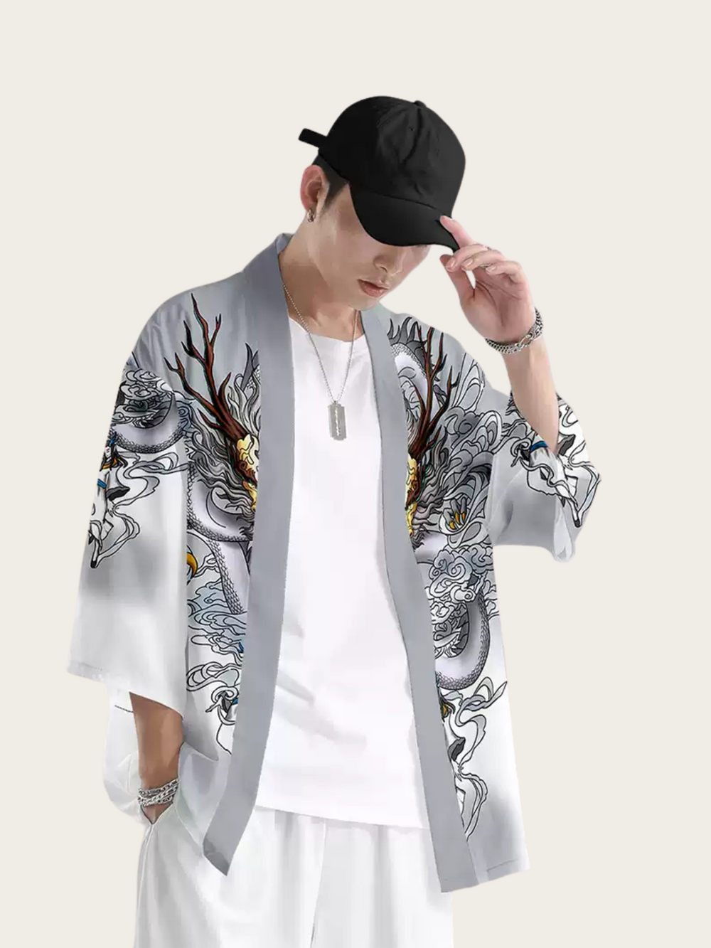 Person wearing a gray kimono-style jacket with intricate designs on a white background