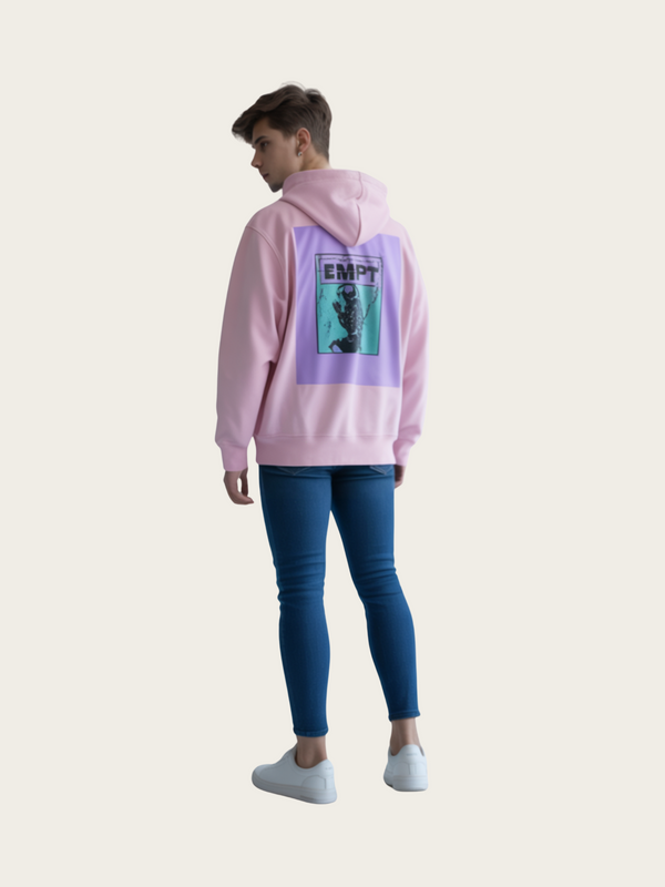 Person wearing a pink hoodie with a graphic design on the back, standing against a white background