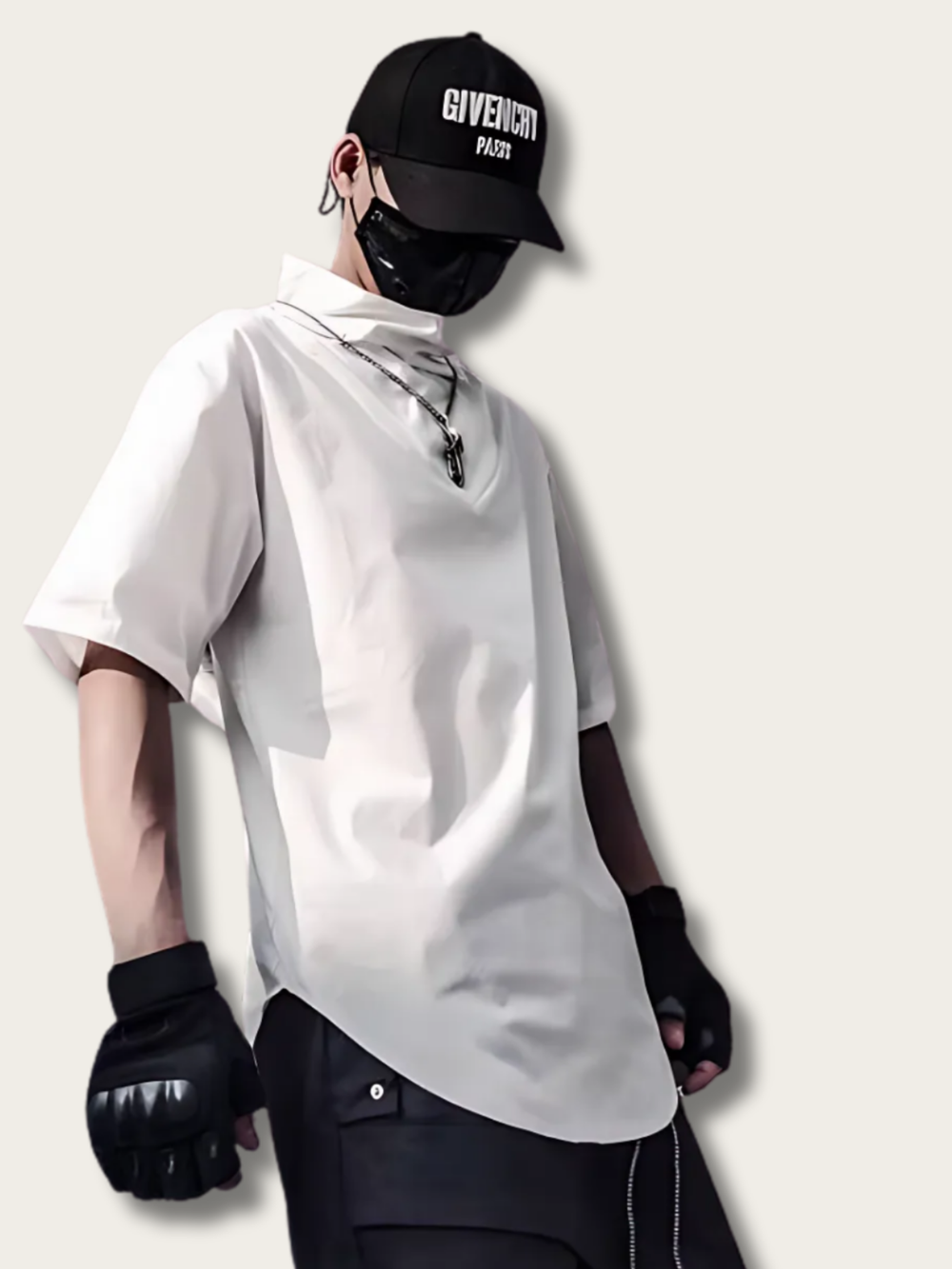 Person wearing a white oversized shirt, black gloves, and a black cap with 'GIVENCHY' branding on a light gray background.