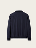 Navy blue bomber jacket on a light beige background