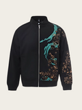 Black jacket with turquoise and brown pattern on a beige background