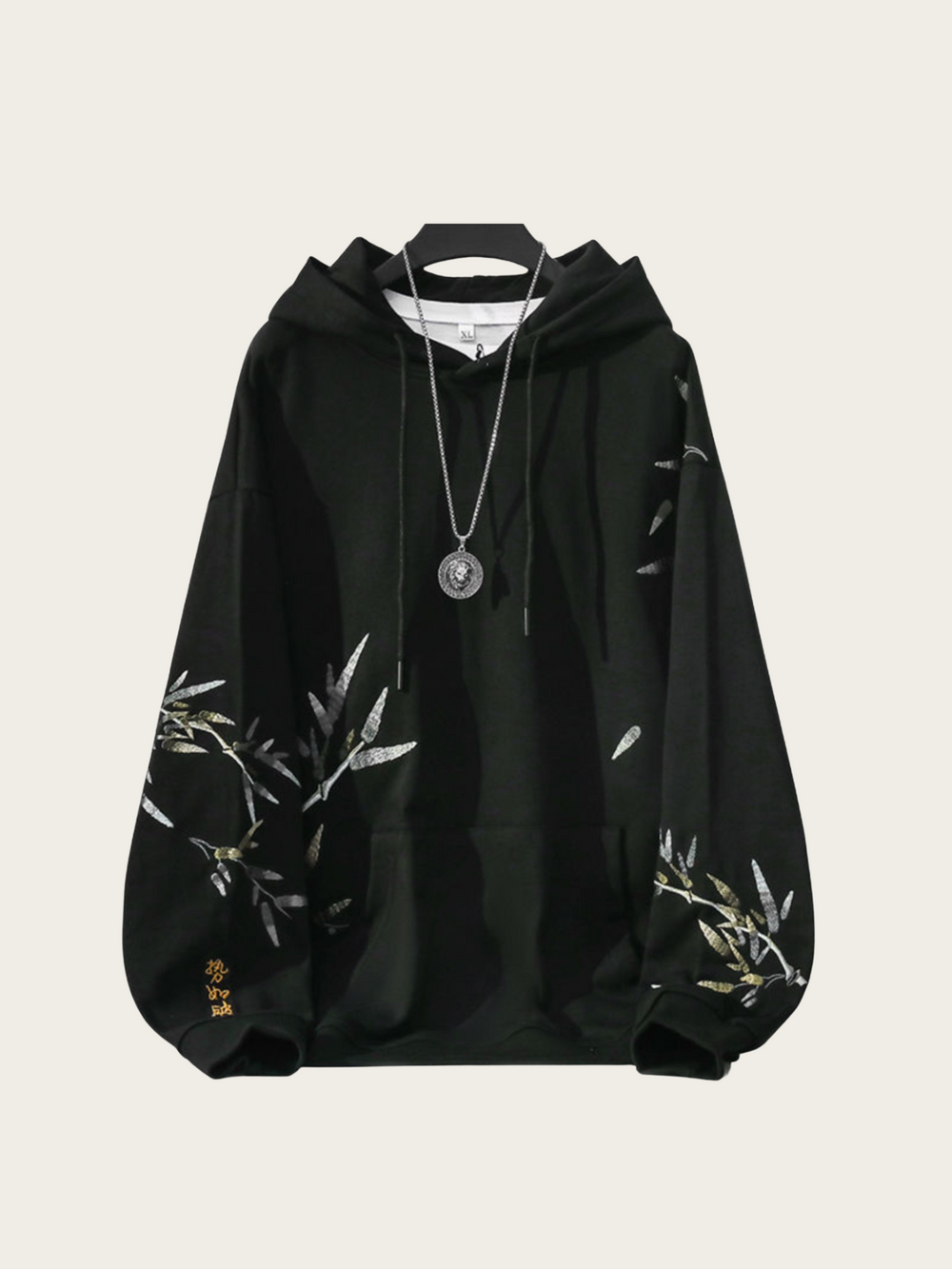 Black hoodie with white floral patterns on a light gray background