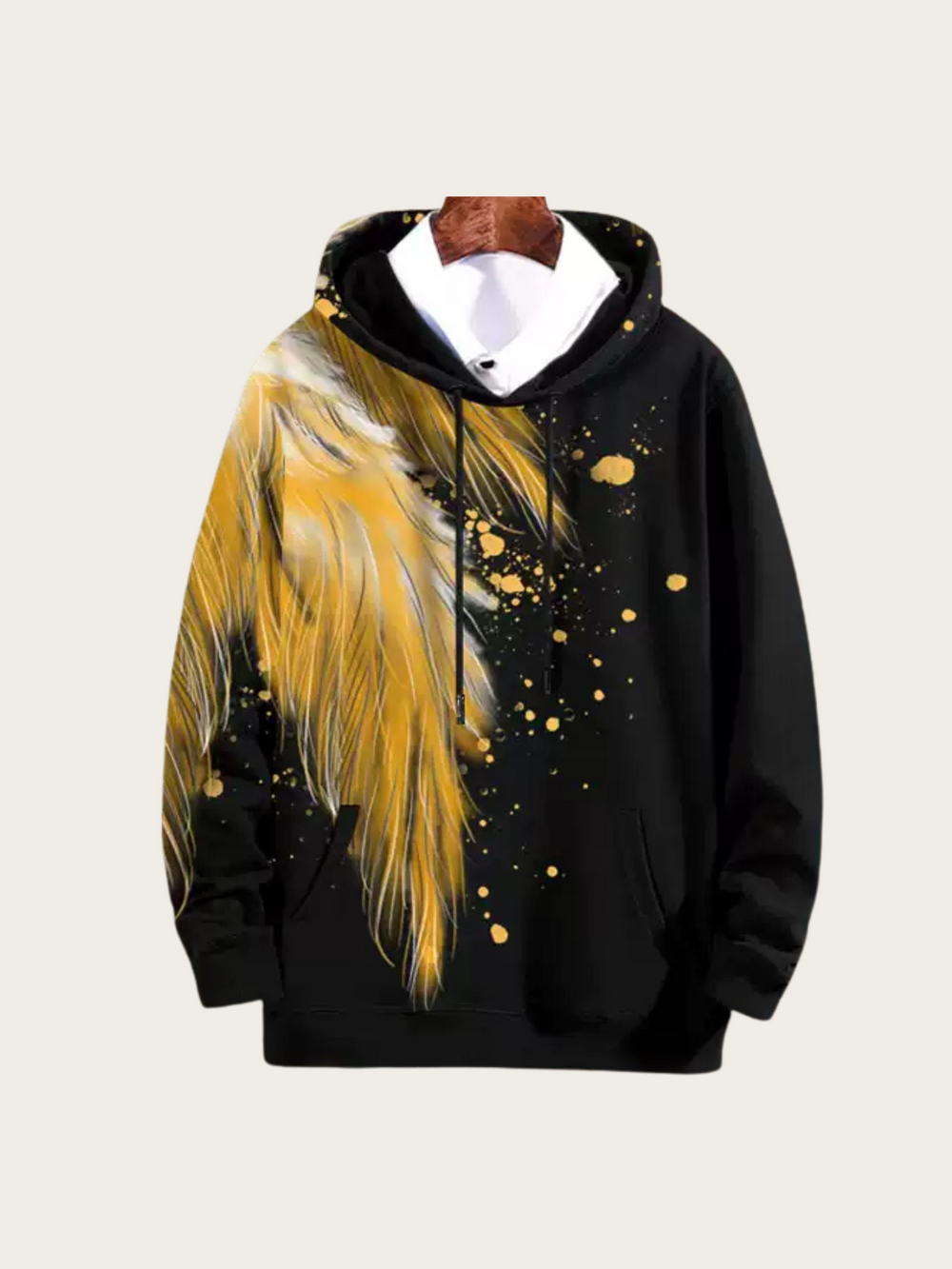 Black hoodie with yellow feather design on a beige background