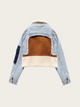 Denim jacket with brown and beige interior on a beige background